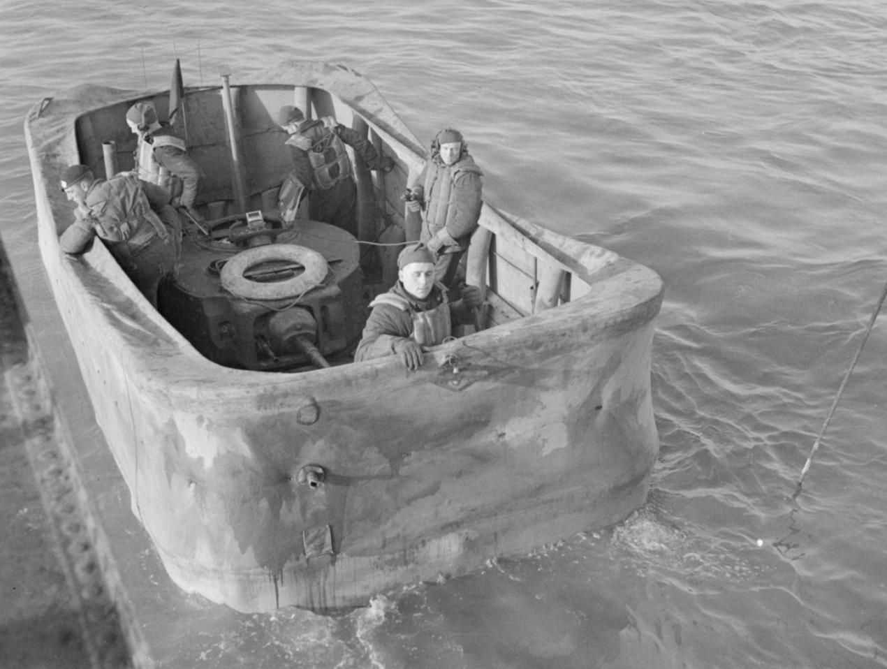 Valentine DD tank with screen erected, in the water alongside a landing craft