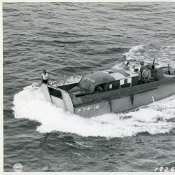 A Higgins C Raft ferrying an ambulance to the beach (#261) during the (...)