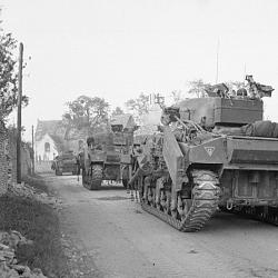 Sherman Crab flail tanks enter Escoville as they move up during Operation (...)