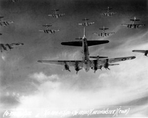 B-17 Flying Fortresses from the 398th Bombardment Group flying a bombing mission to Neumünster, Germany, on 13 April 1945