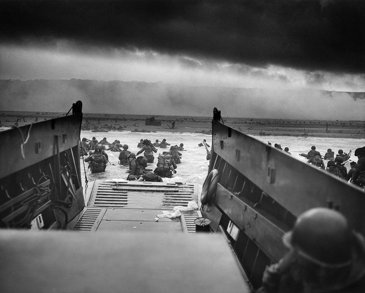 U.S. Troops wading through water and Nazi gunfire circa 1944-06-06